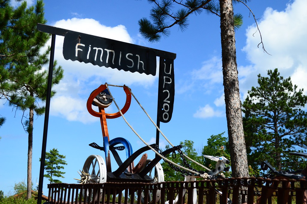 Image of a metal dog race finish line in Lakenenland Sculpture park.